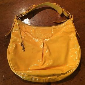 Sunshine yellow patent Dooney & Bourke hobo bag.