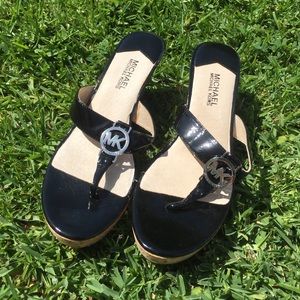 Michael Kors Sandals with a wedge heel.