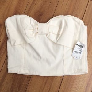 Cream crop top with bow accent