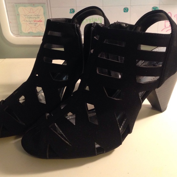 Black coach and four heels. Worn once.