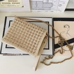 Beige gold tone chain & studs cross body.