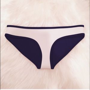 triangl bottoms in white with black stitching