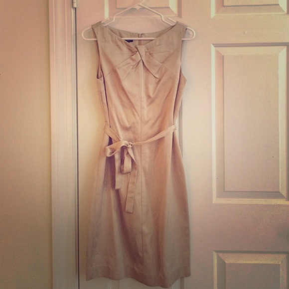 Sophisticated neutral belted sheath dress.