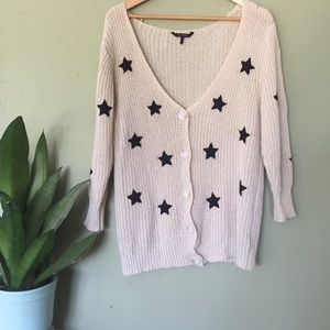 Beige knit cardigan with black stars