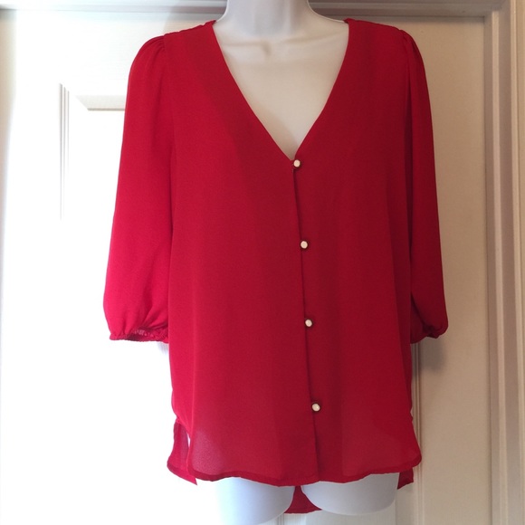 Red shirt with white and gold buttons