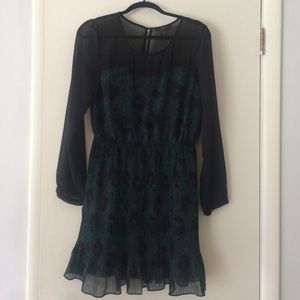 Teal or dark emerald dress.