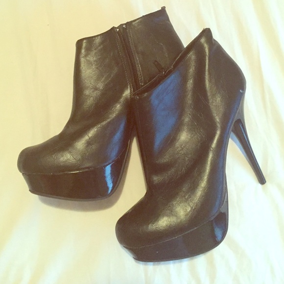 Black platform booties with stiletto heel