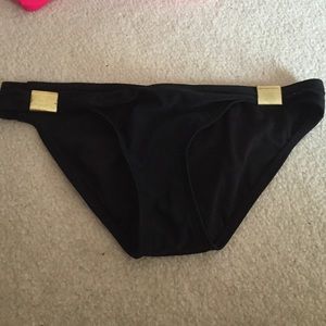 Black bottoms with gold bar