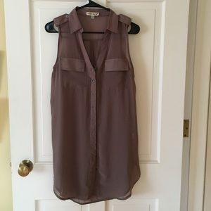 Long button up sleeveless shirt.