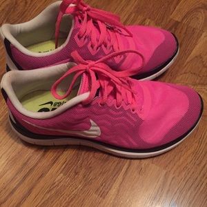 Pink Nike running sneakers