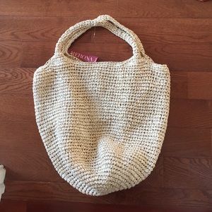 Straw beach tote with silver tinsel woven in
