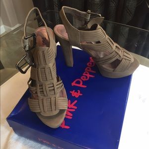 Taupe strappy heels.