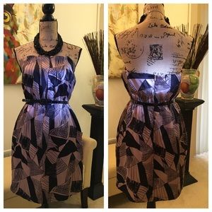 Strapless cocktail dress in black and beige.