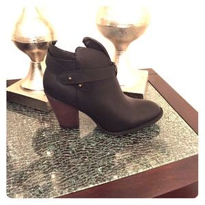 Black XOXO booties.