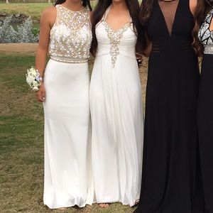 Dress on the LEFT. Tony bowls two piece