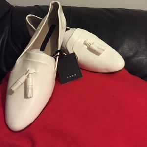 White patent leather loafers