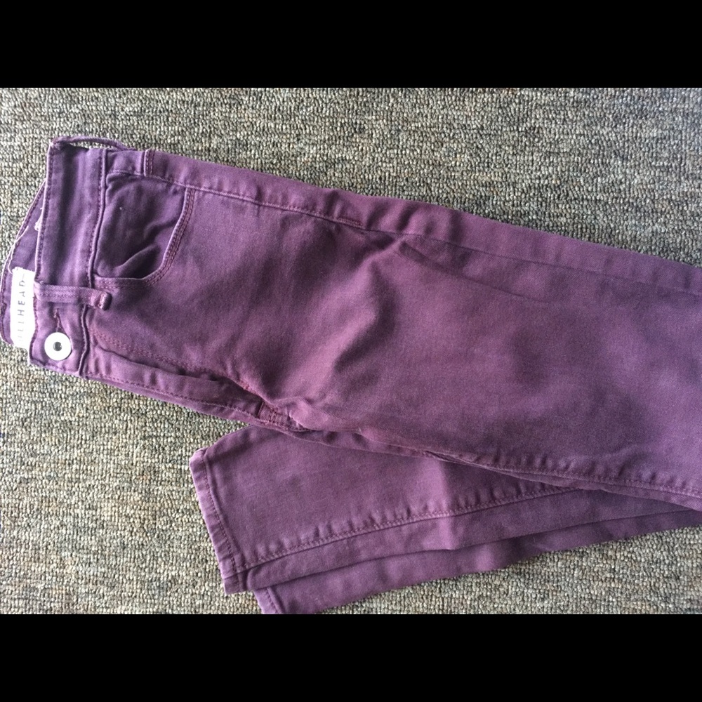 Dark maroon skinny high rise jeans