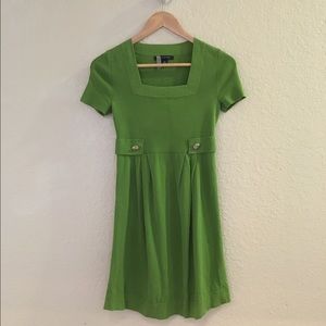 Green dress with gold buttons
