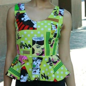Peplum shirt with comic book scenes.