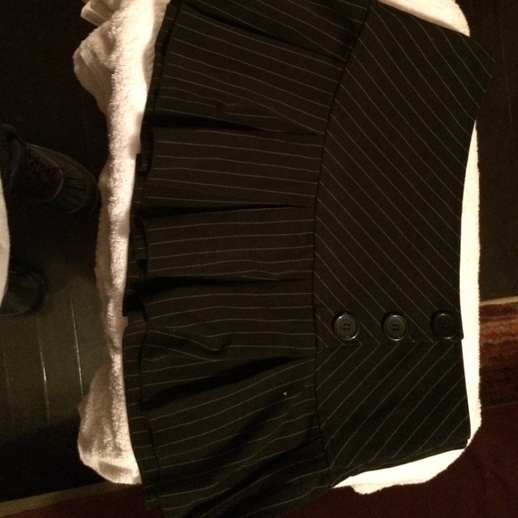 Black pinstriped mini skirt with pleat and buttons