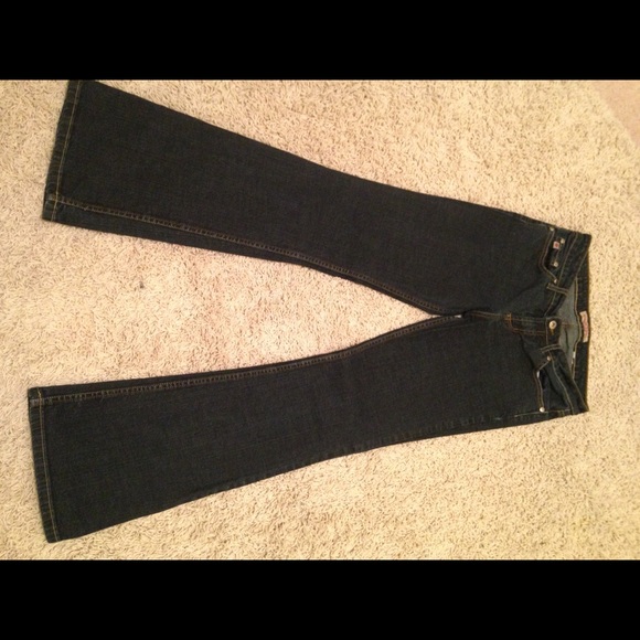 Dark blue denim jeans with a slight flare leg