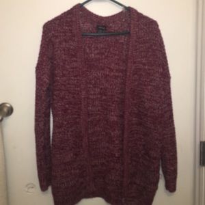 a maroon cardigan