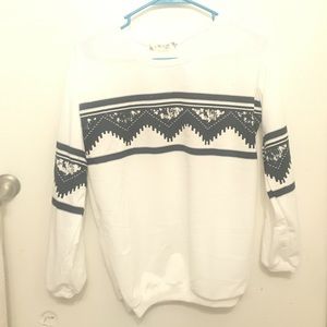 white sweater with black designs