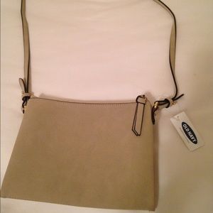 Brand new, never used suede sling w3 compartments.