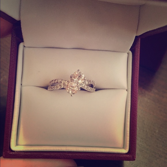 Diamond and white sapphire ring