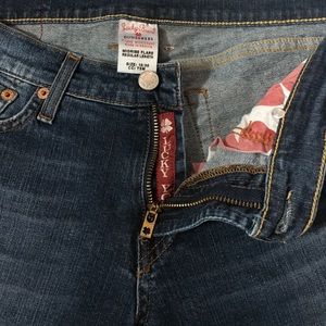 LUCKY mid rise flare medium wash