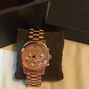 Michael Kors rose gold watch.