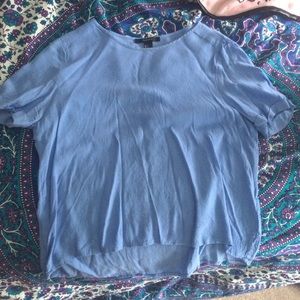 loose fitting light blue top