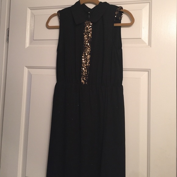 Black dress with gold sequins.