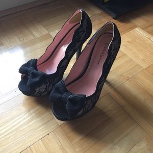 Cream and black lace heels with bow detail