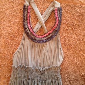 Cute tan sundress with beading.