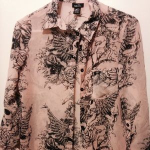 Pink shirt with skeletons