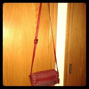 Red Coach bag with leather strap