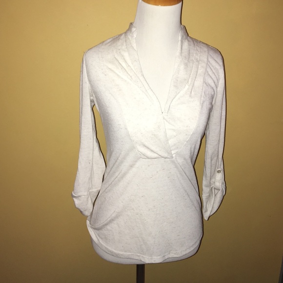 Cream colored blouse.