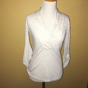 Cream colored blouse.