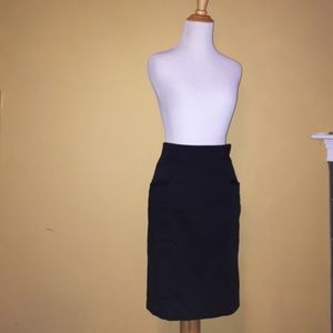 Black, knee length pencil skirt.
