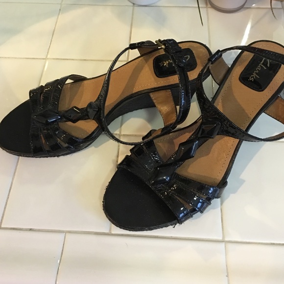 Black wedge sandals by Clarks