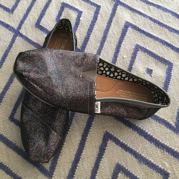 Gently used, purple/sparkle TOMS (size W7)