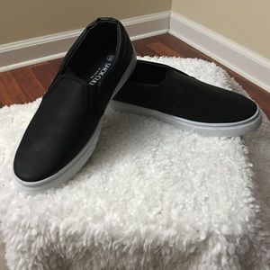 New in box. Slip on black shoes