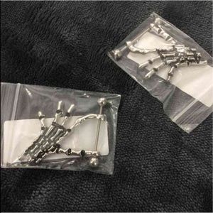 Skeleton hand nipple ring