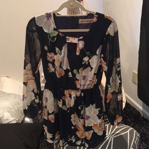 Navy romper with peach and white flowers