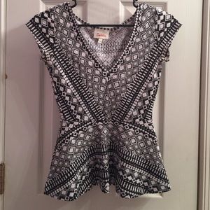 Black and white peplum deletta top