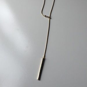 Long and adjustable gold statement necklace