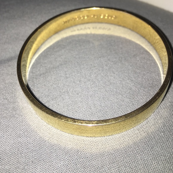 Solid Gold idiom bangle.