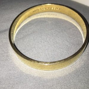 Solid Gold idiom bangle.