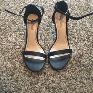 A pair of black heels